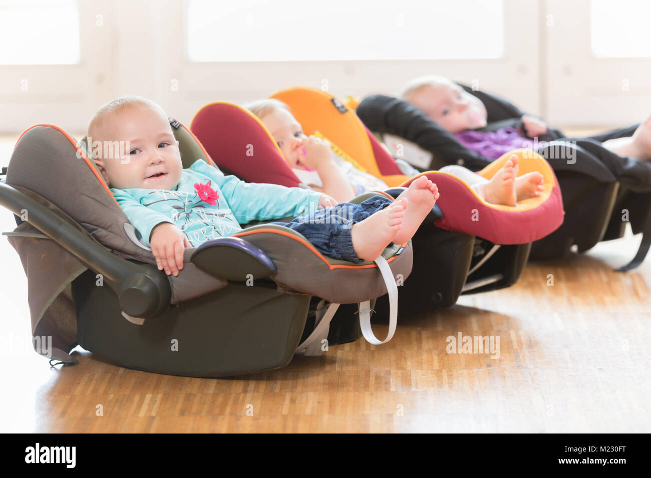 New-born babies in toddler group lying in baby shells Stock Photo