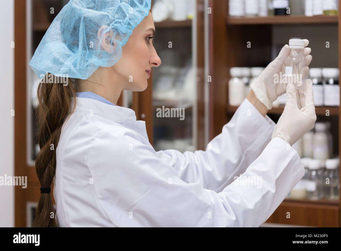 Woman chemist during experimental work Stock Photo