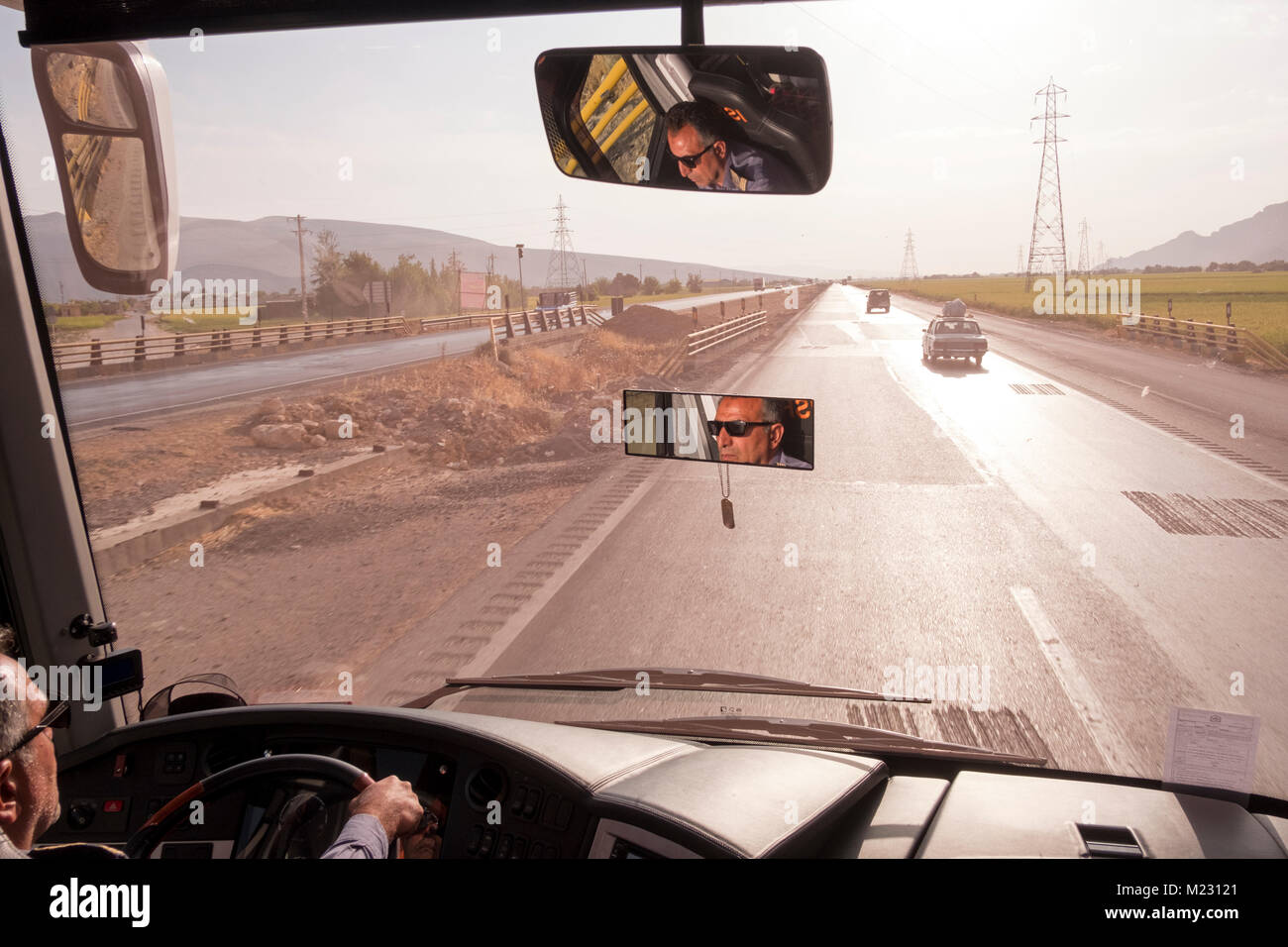 A bus being driven on the highway in Isfahan province, Iran Stock Photo