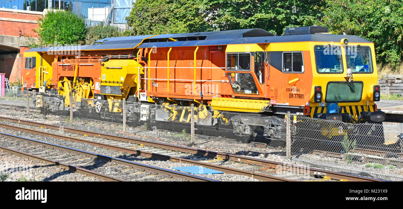 Colas Rail specialised ballast regulator infrastructure machine for placement & grading  of aggregates under railway tracks parked up at Slough UK Stock Photo