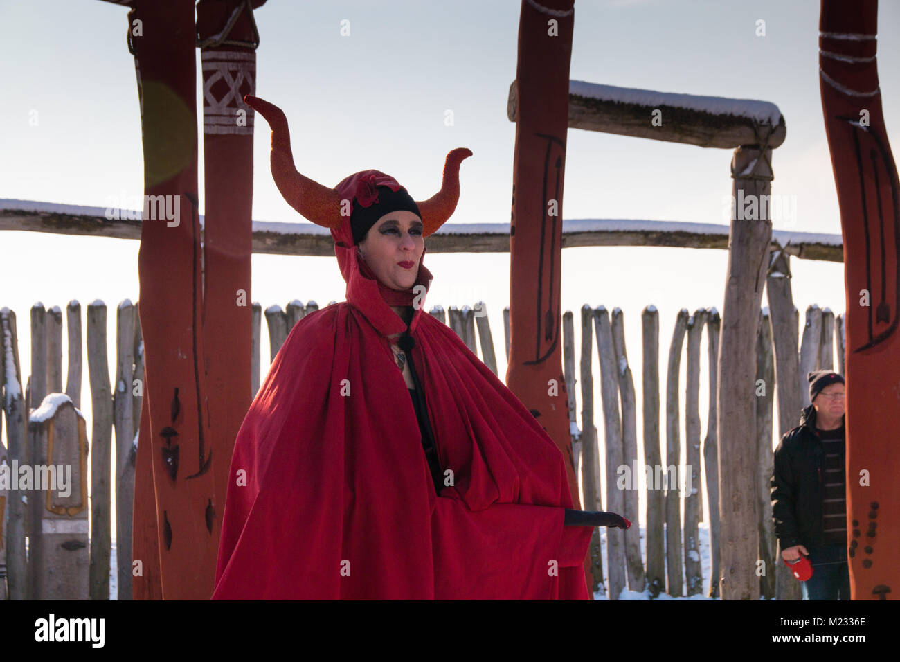 Poemmelte, Germany - February 4,2018: A fire-eater in a devil's costume drives away the winter in the Ringhe sanctuary of Poemmelte. The prehistoric r Stock Photo