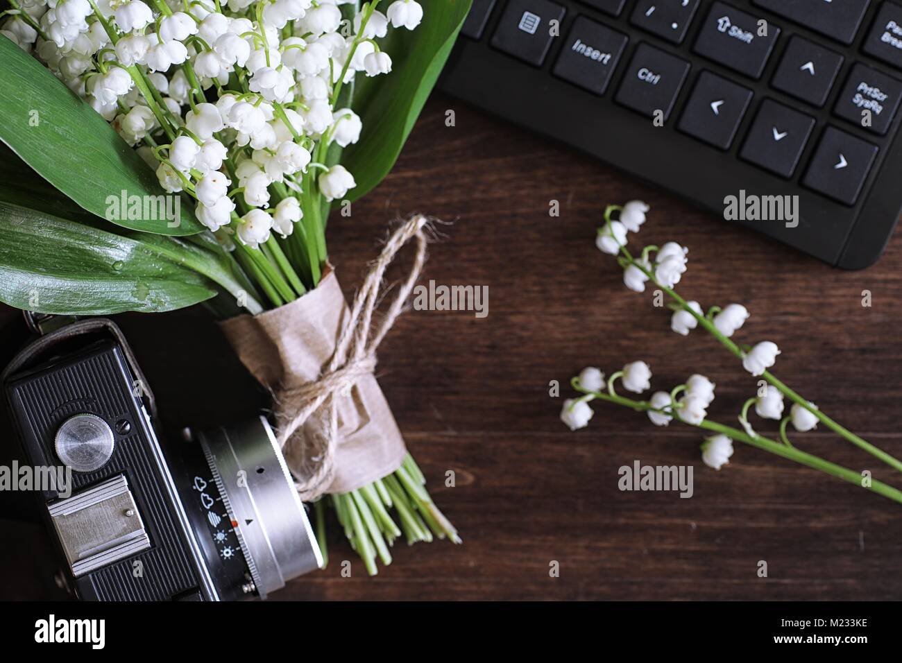 Bouquet of lilies of the valley on a table Stock Photo - Alamy