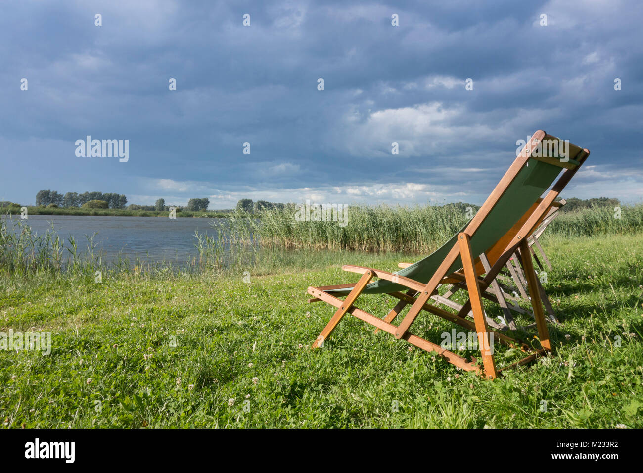 Loungers on a lake, Brandenburg, Linum Stock Photo