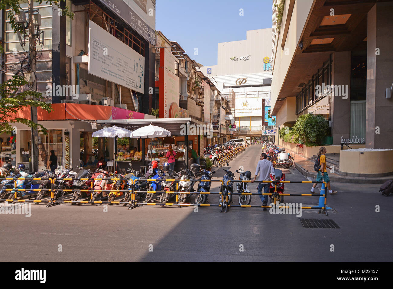 Bangkok, Siam Square, Thailand - January 4, 2016: Busy scooter parking and shopping streets in Siam commercial center in Thailand capital. Stock Photo