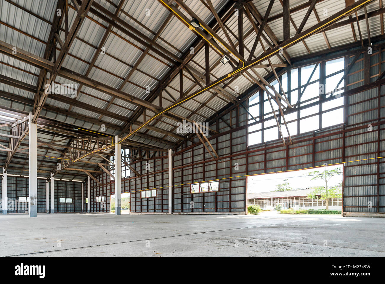 Empty old and rustic hangar building Stock Photo