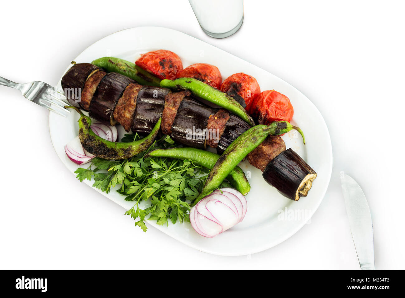 Eggplant kebab in Turkish Patlican Kebap, on a white background and