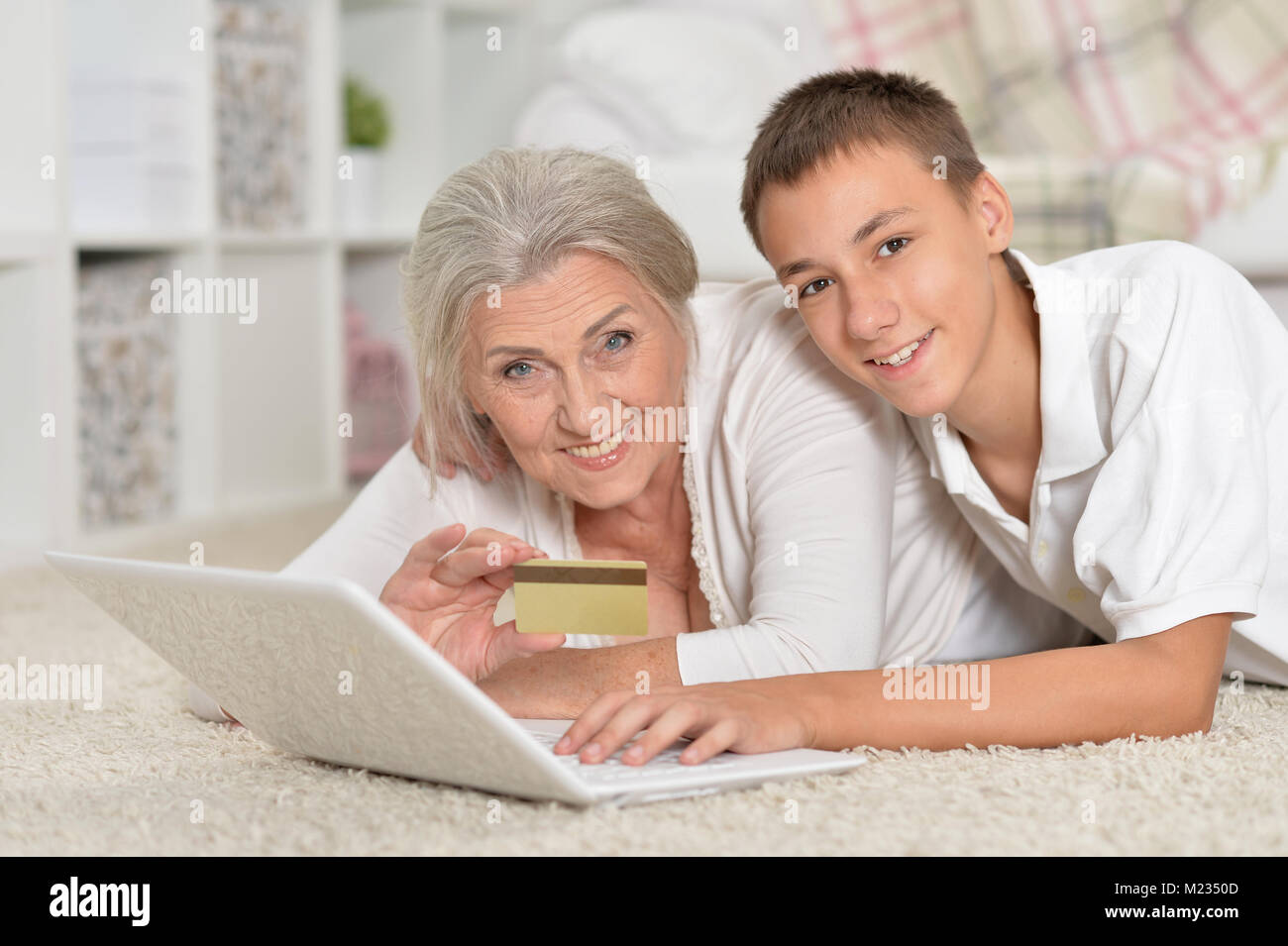 grandmother and grandson using laptop, online shopping concept Stock Photo