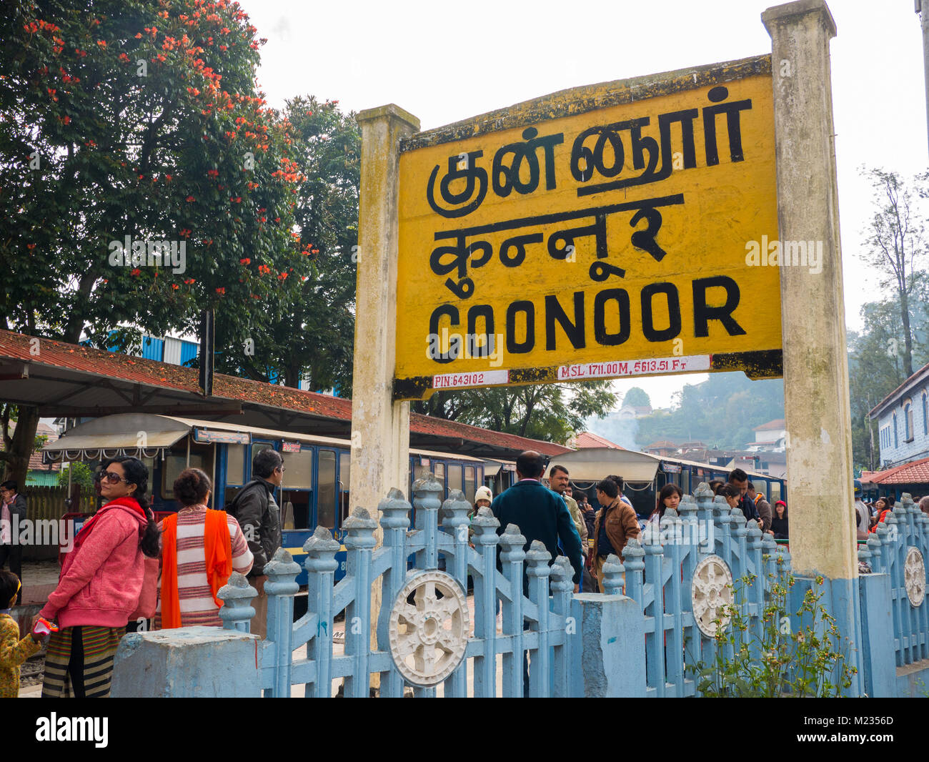 COONOOR, TAMIL NADU, INDIA, 01/08/2018. : Nilgiri mountain railway. Blue train. People waiting for the train. The train station of Coonoor. Stock Photo