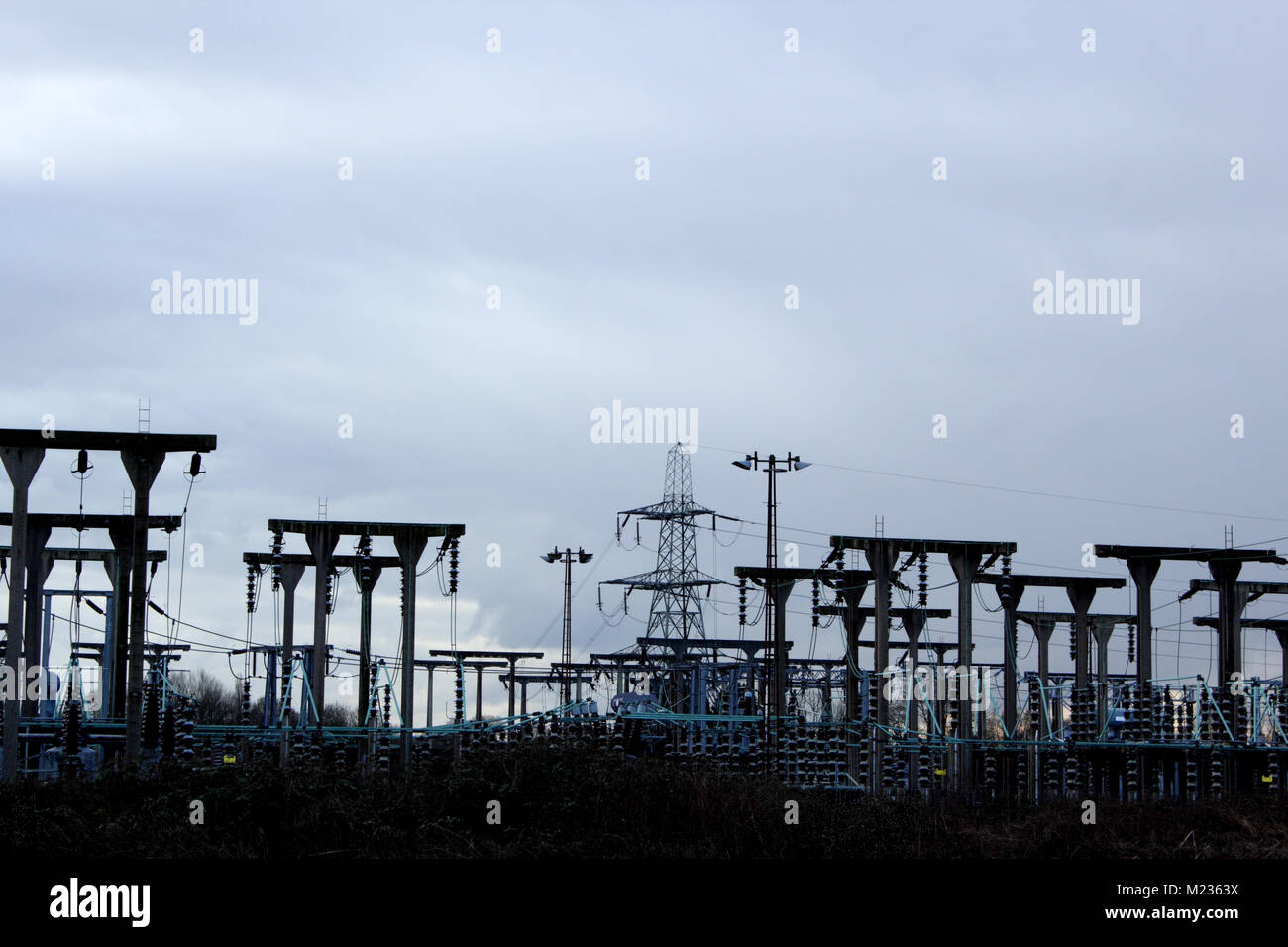 Electricity sub-station showing wires and pylons Stock Photo