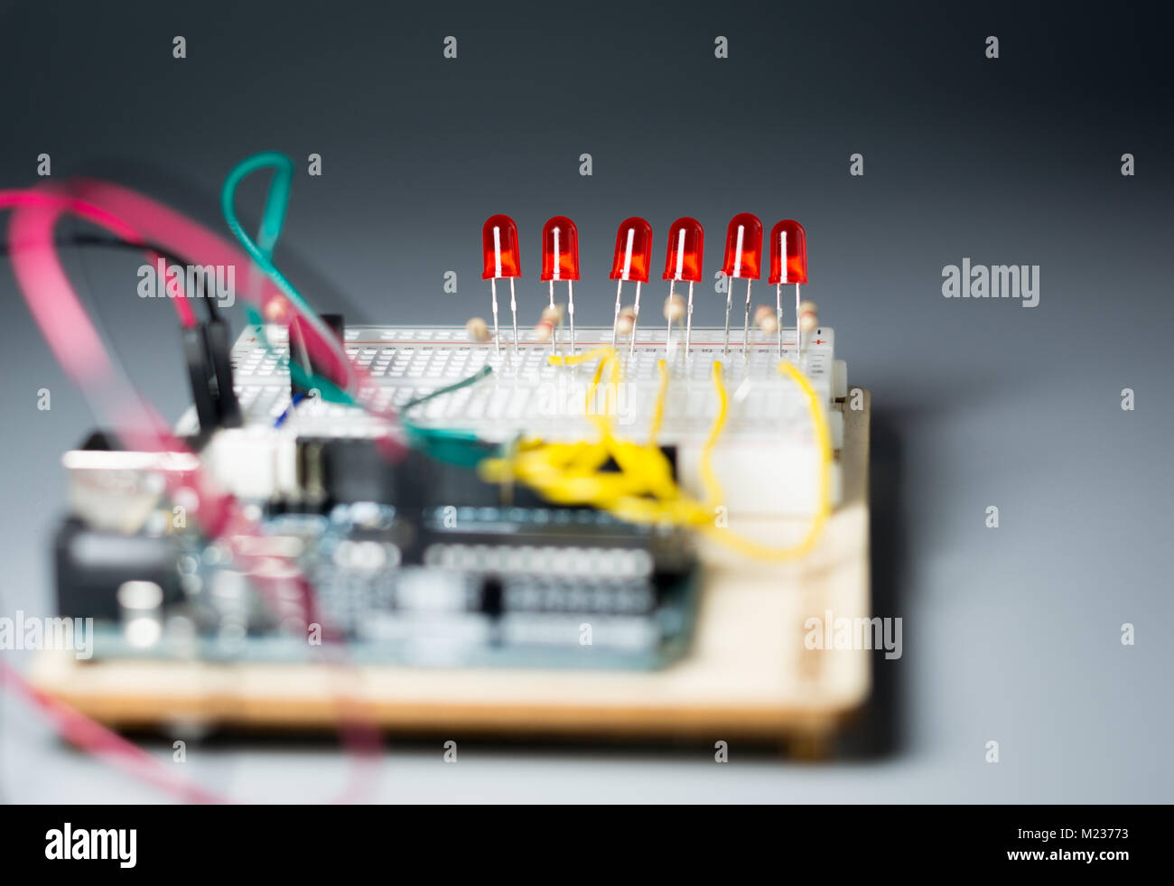 Array of red LEDs on a breadbord connected to a microcontroller Stock Photo