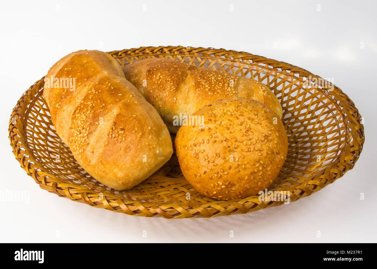 whole wheat breads and bun on a wicker plate Stock Photo - Alamy