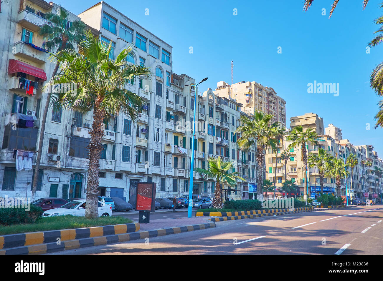 ALEXANDRIA, EGYPT - DECEMBER 17, 2017: The row of residential buildings in Corniche avenue, one of the most popular city locations, stretching along t Stock Photo