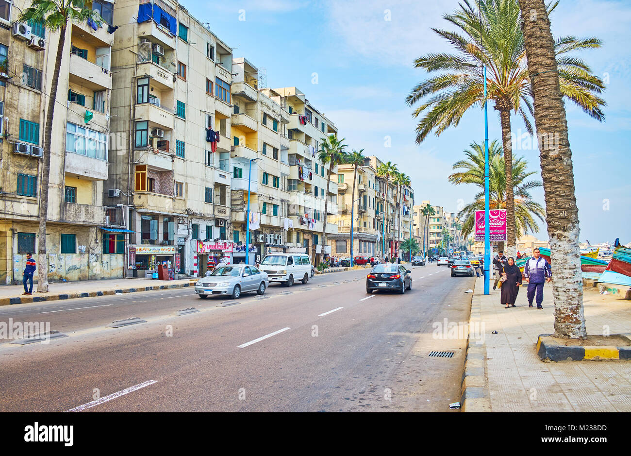 ALEXANDRIA, EGYPT - DECEMBER 17, 2017:  The Corniche avenue runs along the Eastern Harbor, here locate shabb residential quarters, fish market, small  Stock Photo