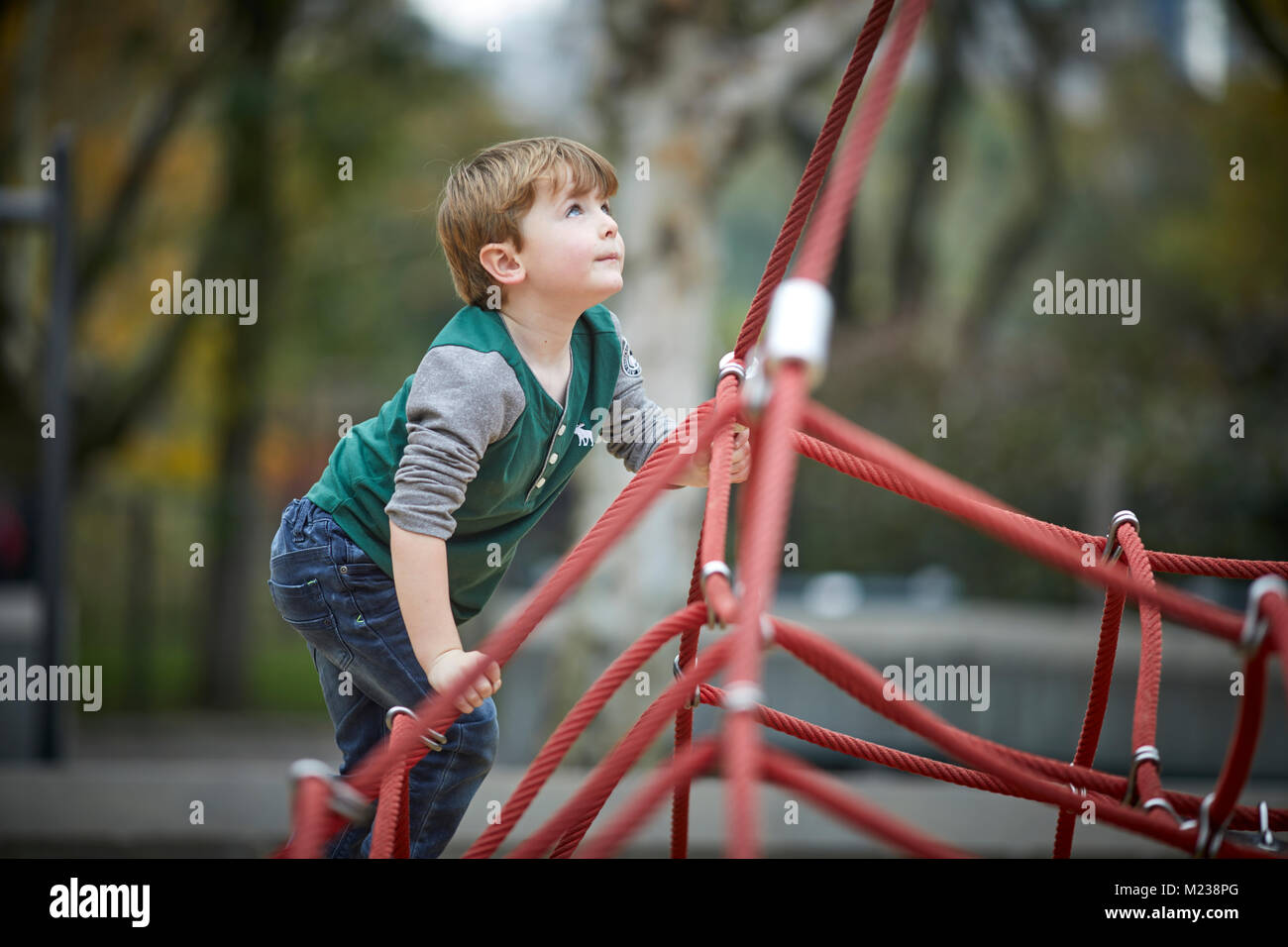 New York City Manhattan Central Park boy on rope triangle climbing frame Stock Photo Alamy