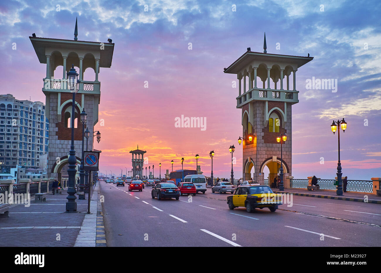 ALEXANDRIA, EGYPT - DECEMBER 17, 2017: The fast traffic along the Stanley bridge with a view on the bright sunset sky, on December 17 in Alexandria. Stock Photo