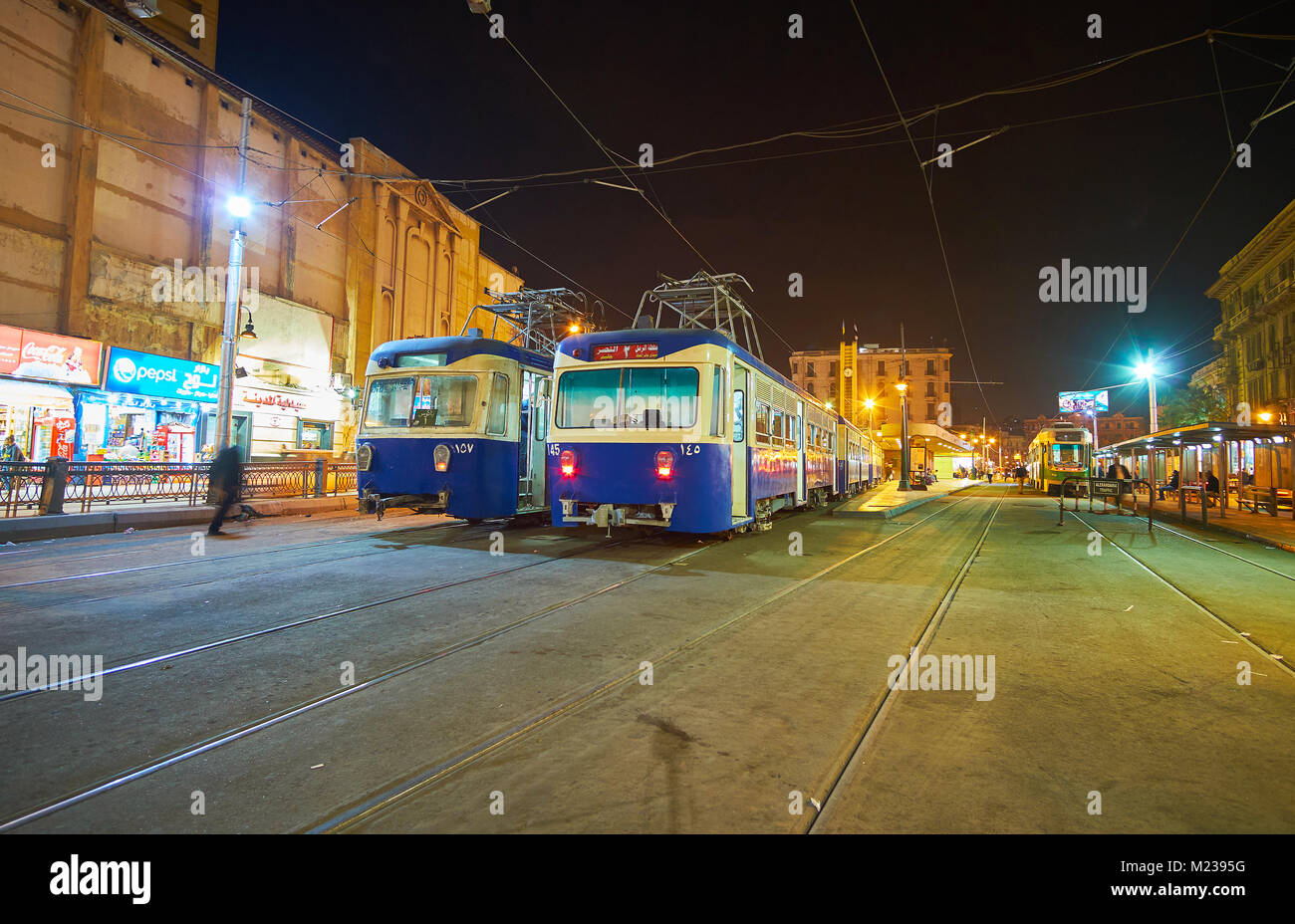 ALEXANDRIA, EGYPT - DECEMBER 17, 2017: Two blue trams stay on the terminus station in Mahta Al Raml square, located in old town, on December 17 in Ale Stock Photo