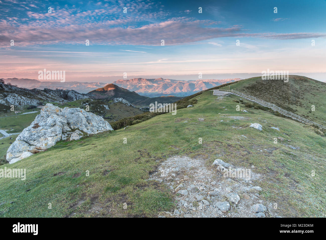 spectacular and colorful sunset in the lakes of Covadonga, Asturias, on a very cold winter day, where you can see the beautiful colors of the clouds, Stock Photo