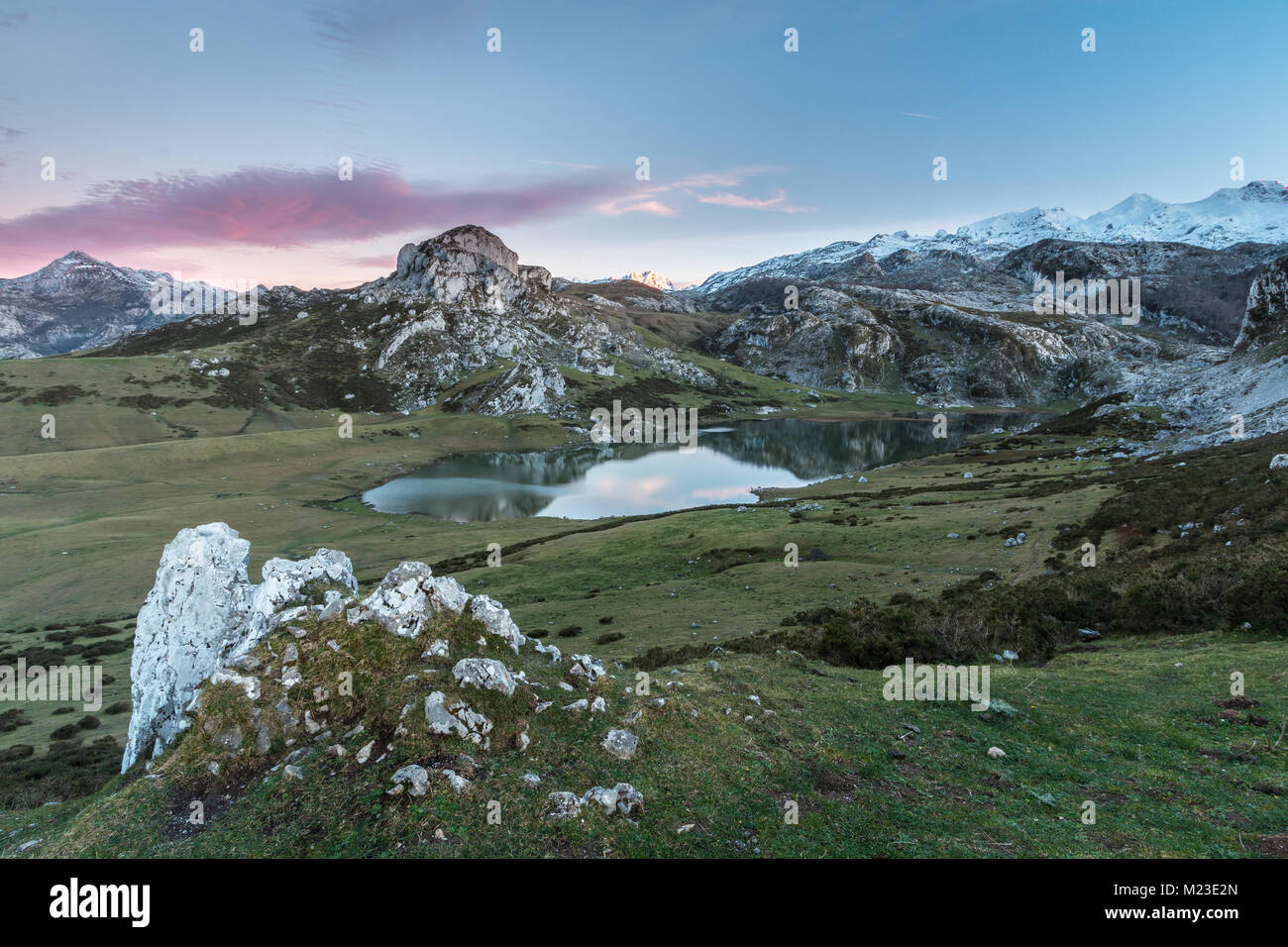 spectacular and colorful sunset in the lakes of Covadonga, Asturias, on a very cold winter day, where you can see the beautiful colors of the clouds, Stock Photo
