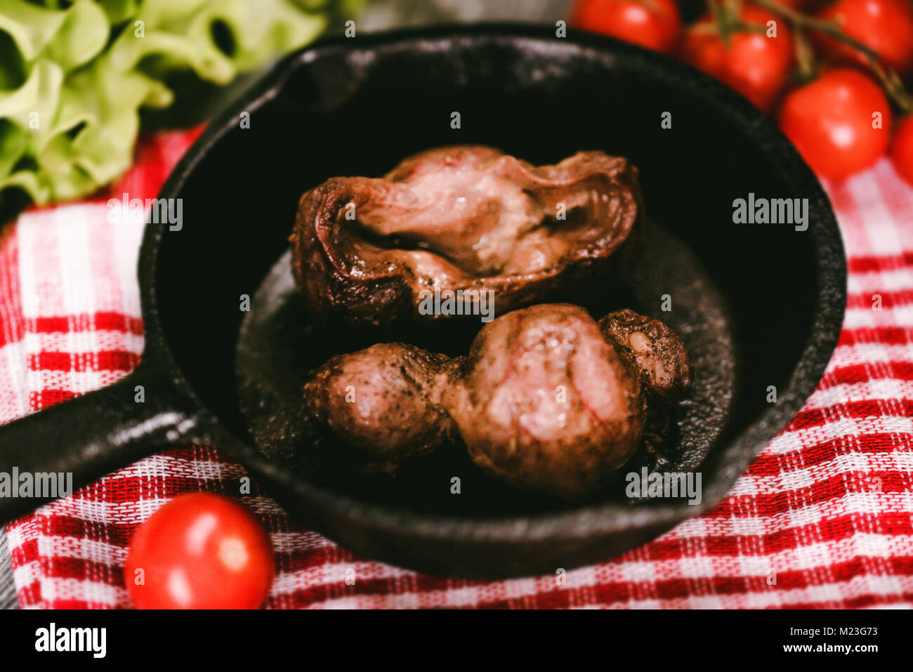 Tasty roasted chicken giblets in pan Stock Photo Alamy