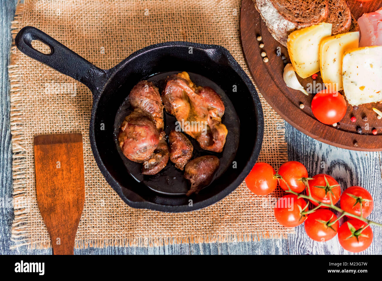 Top view roasted chicken giblets in pan and bread Stock Photo Alamy