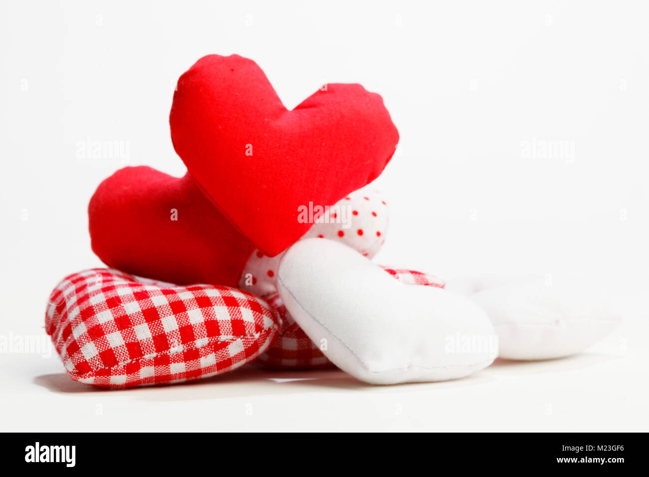 Textile red hearts isolated on white background Stock Photo - Alamy