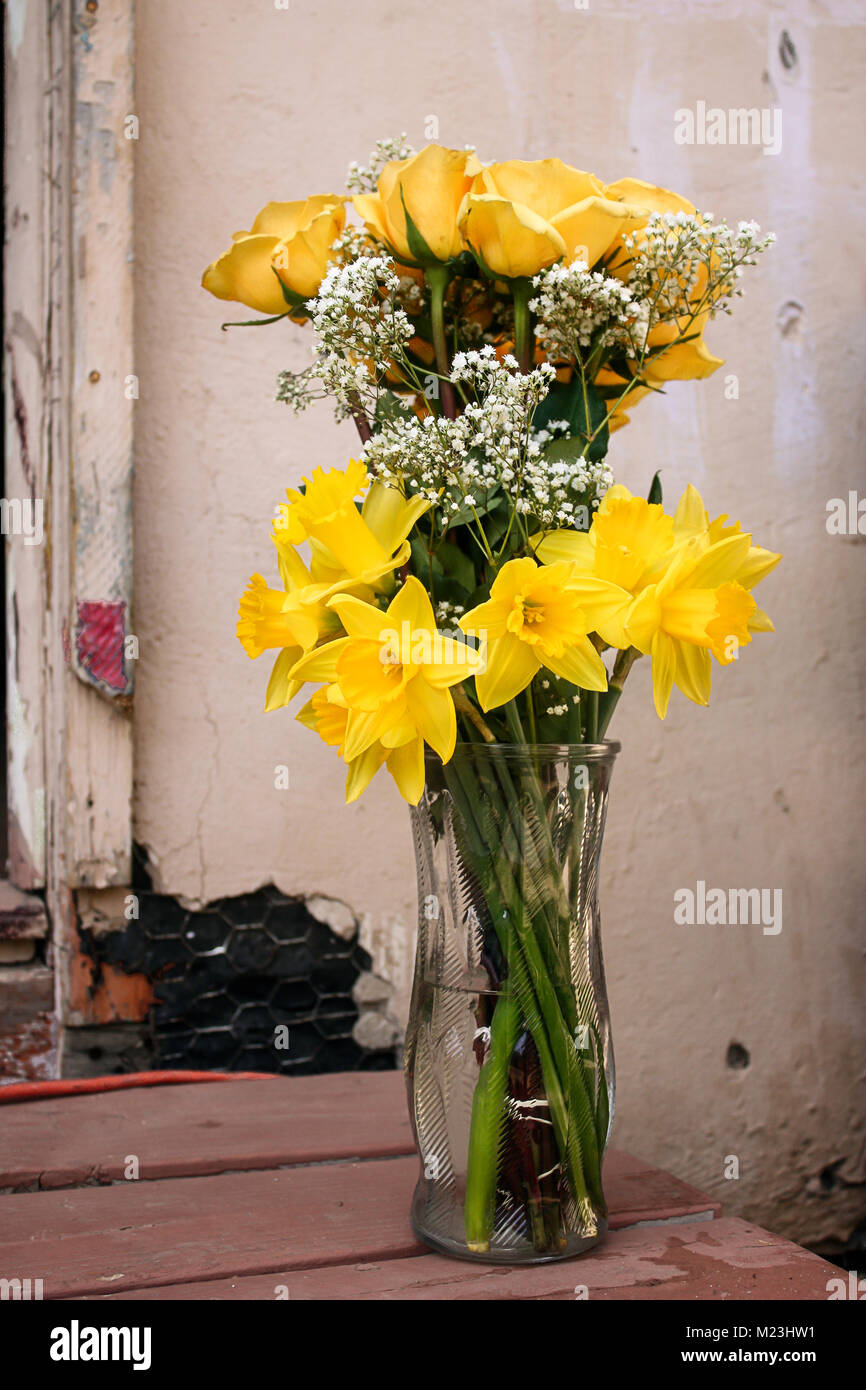 Bouquet of bright yellow flowers in a vase Stock Photo Alamy