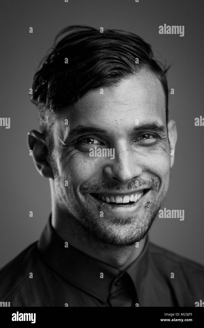 Black and white portrait of a young handsome man. Studio shot Stock ...