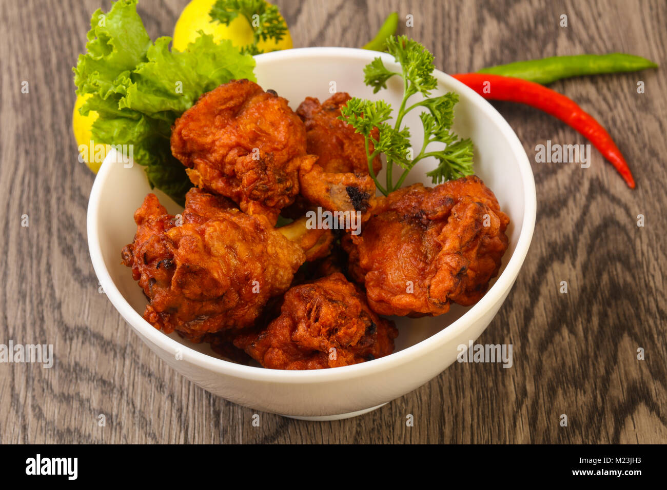 Indian traditional cuisine Chicken lollipops with spices Stock Photo