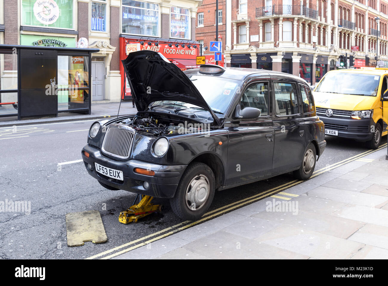 Black Cab Taxi Breakdown on London Street.UK. Stock Photo