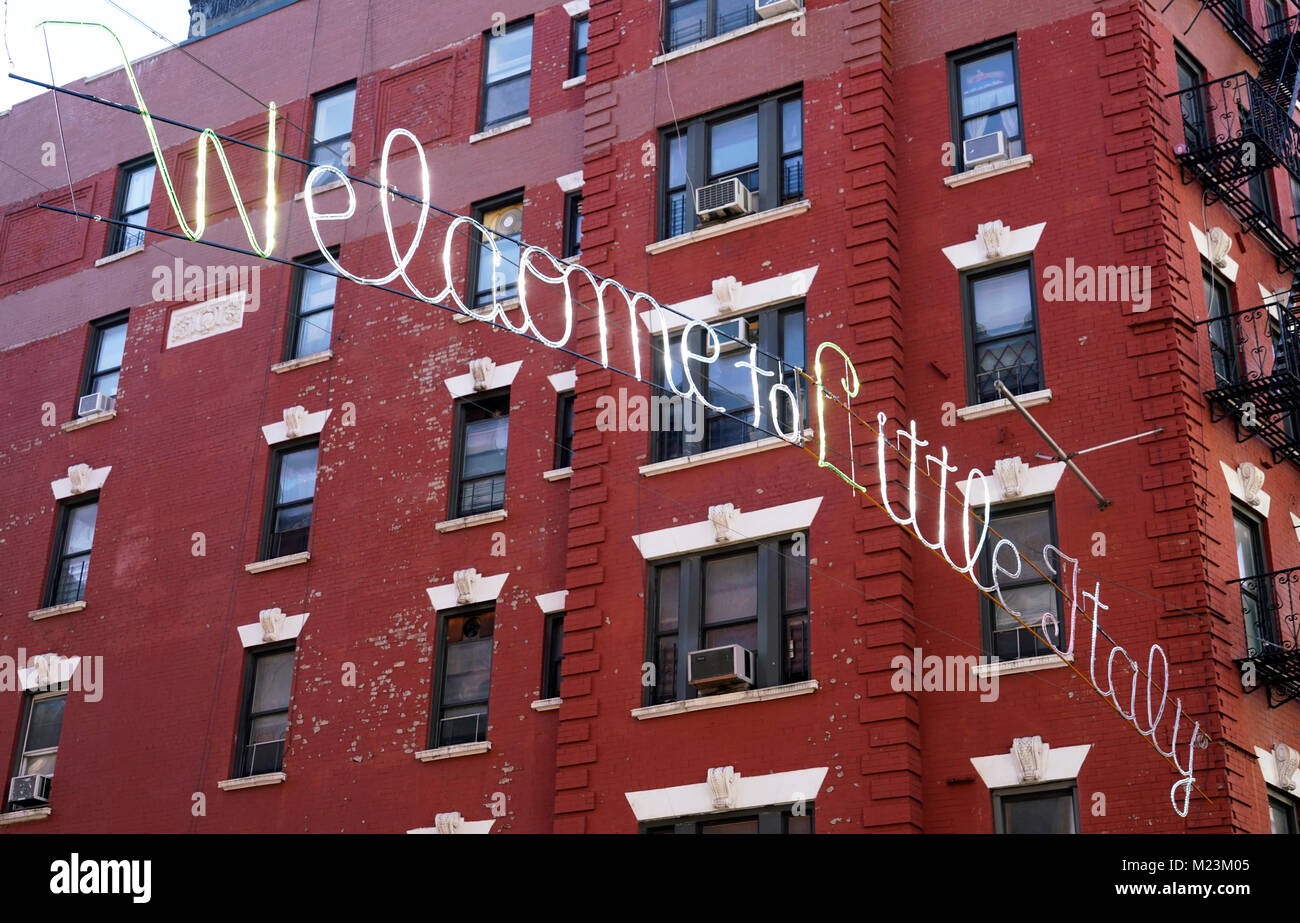 A closed up view of Welcome to Little Italy sign hanging at the intersection of Mulberry street and Broome Street.Lower Manhattan.New York City.USA Stock Photo