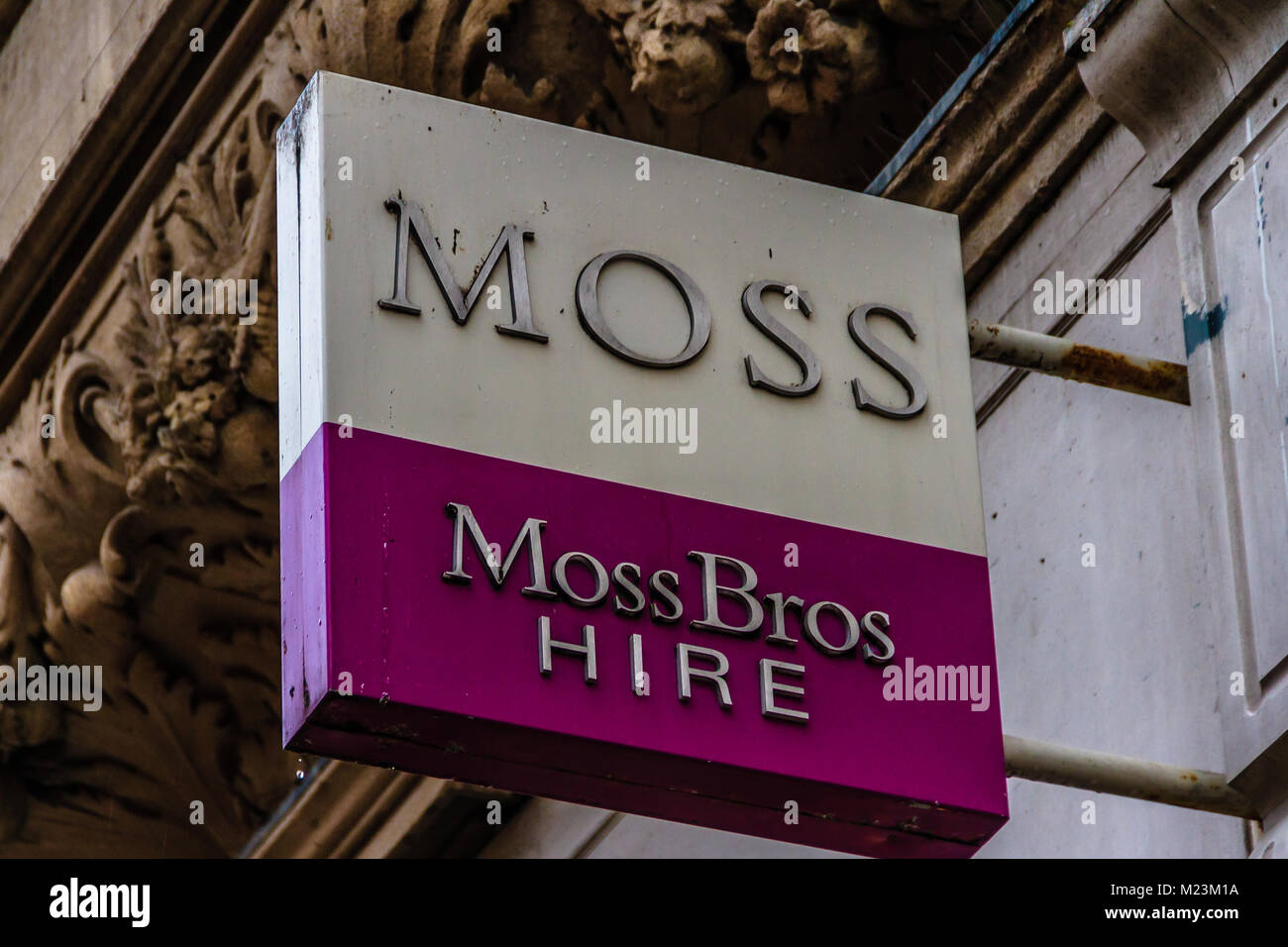 Moss Bros suit hire shop sign on Cornmarket Street, Oxford, Oxfordshire, UK. Feb 2018 Stock Photo