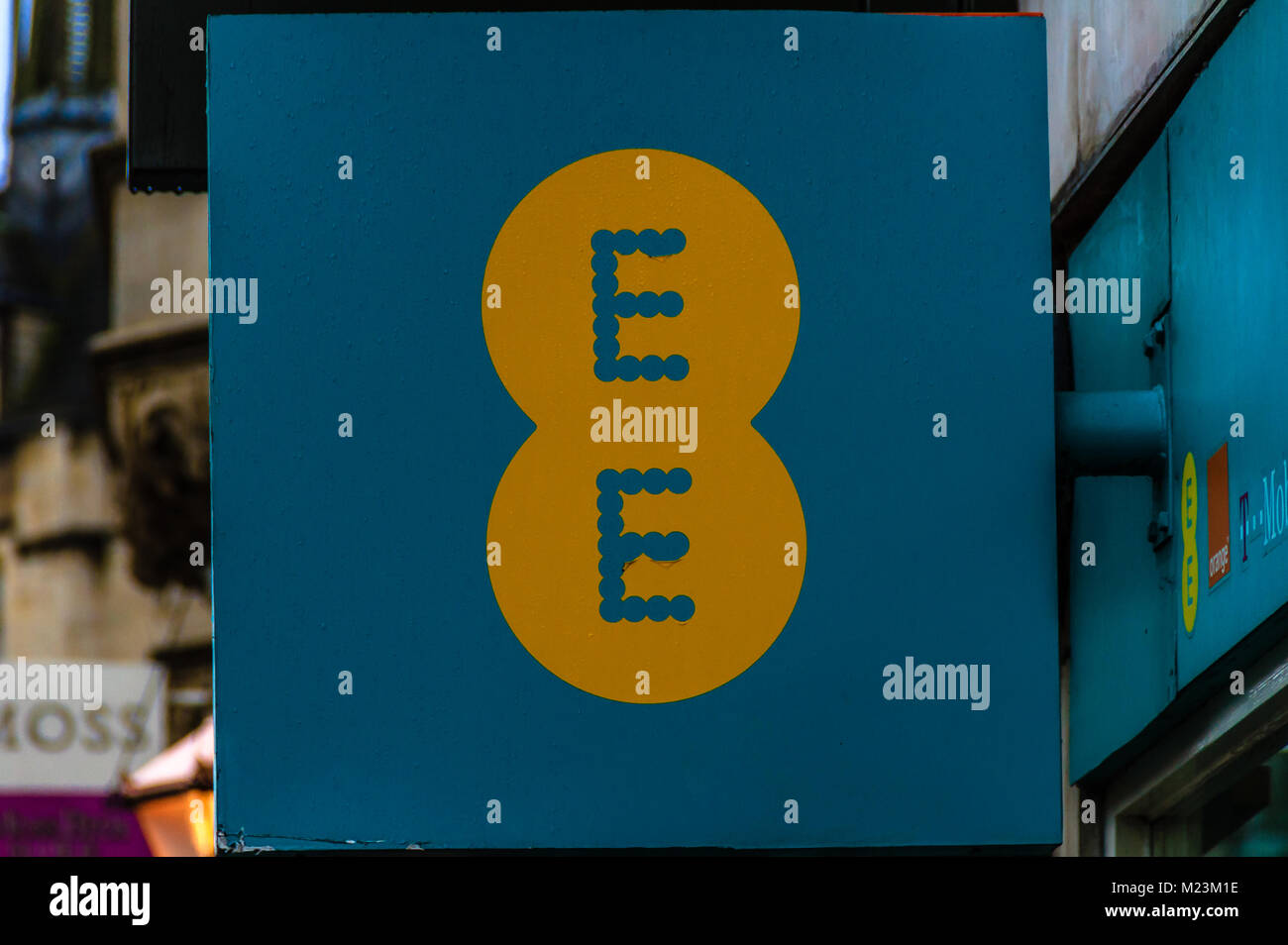EE sign on mobile phone network shop on Cornmarket Street, Oxford, Oxfordshire, UK. Feb 2018