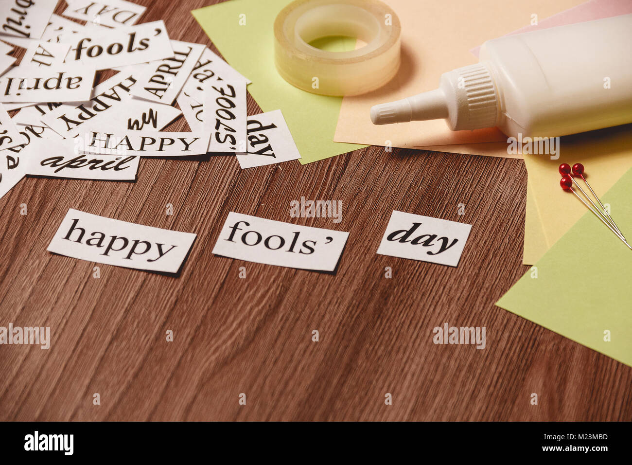 Happy Fools Day phrase on wooden background Stock Photo