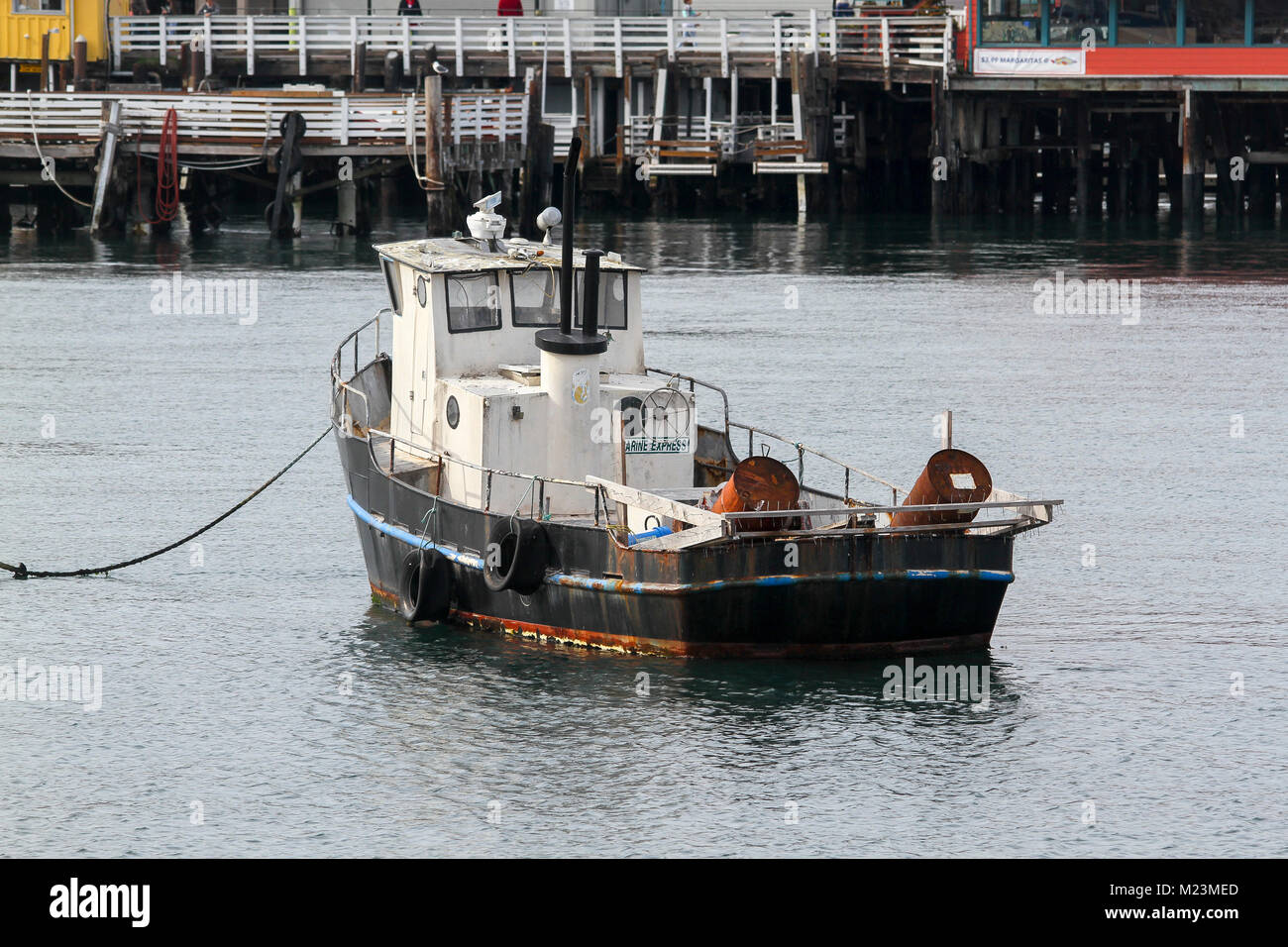 An old boat docked at Municipal Wharf II, Monterey, California, United States Stock Photo