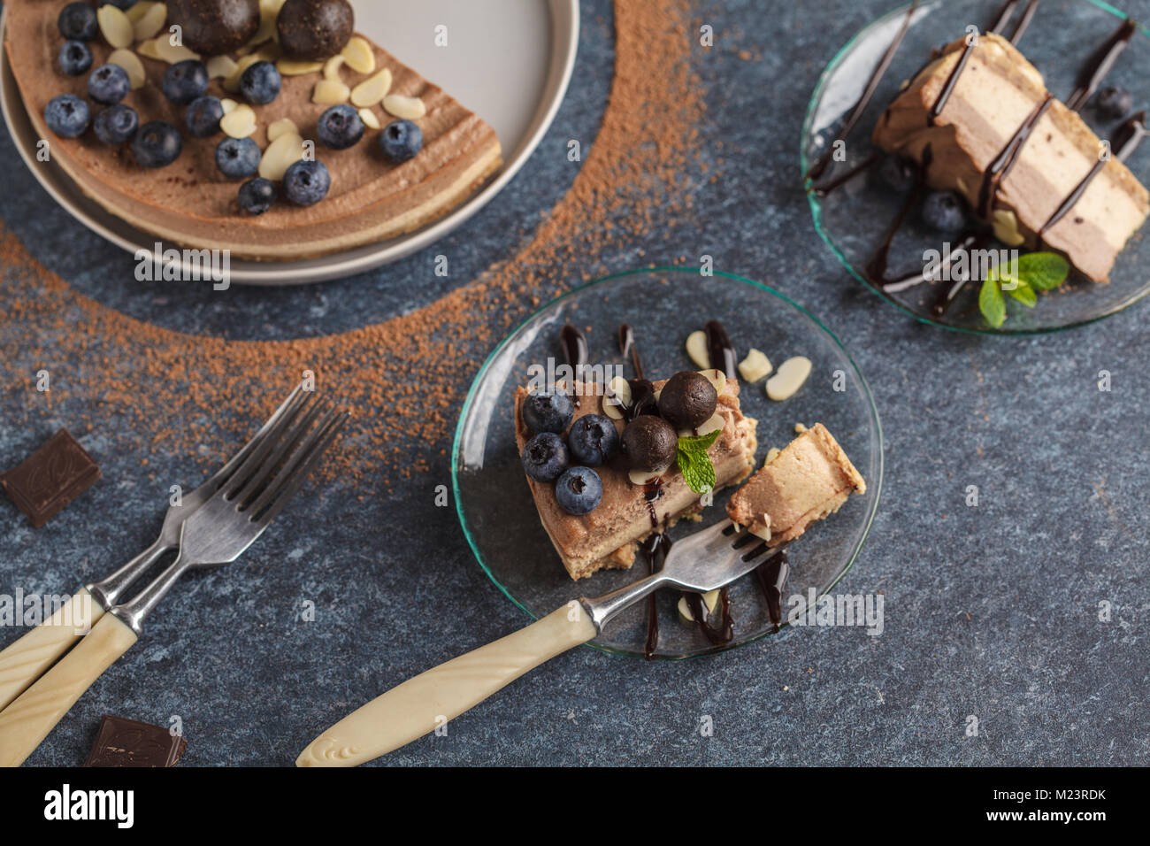 Raw vegan chocolatecaramel cheesecake with blueberries, raw candy