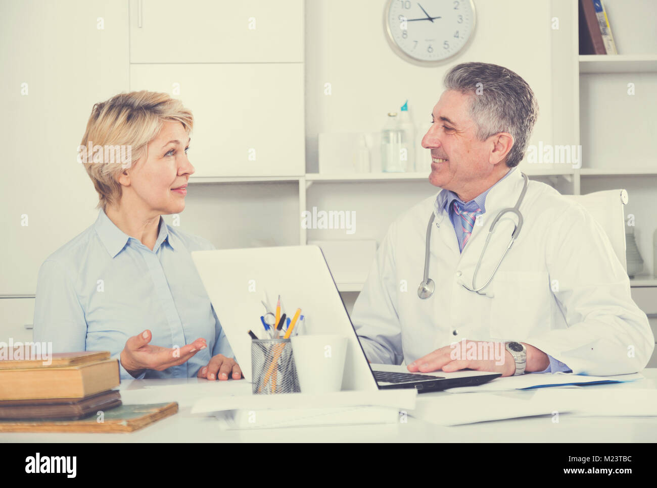 Mature woman visits doctor hi-res stock photography and images - Alamy