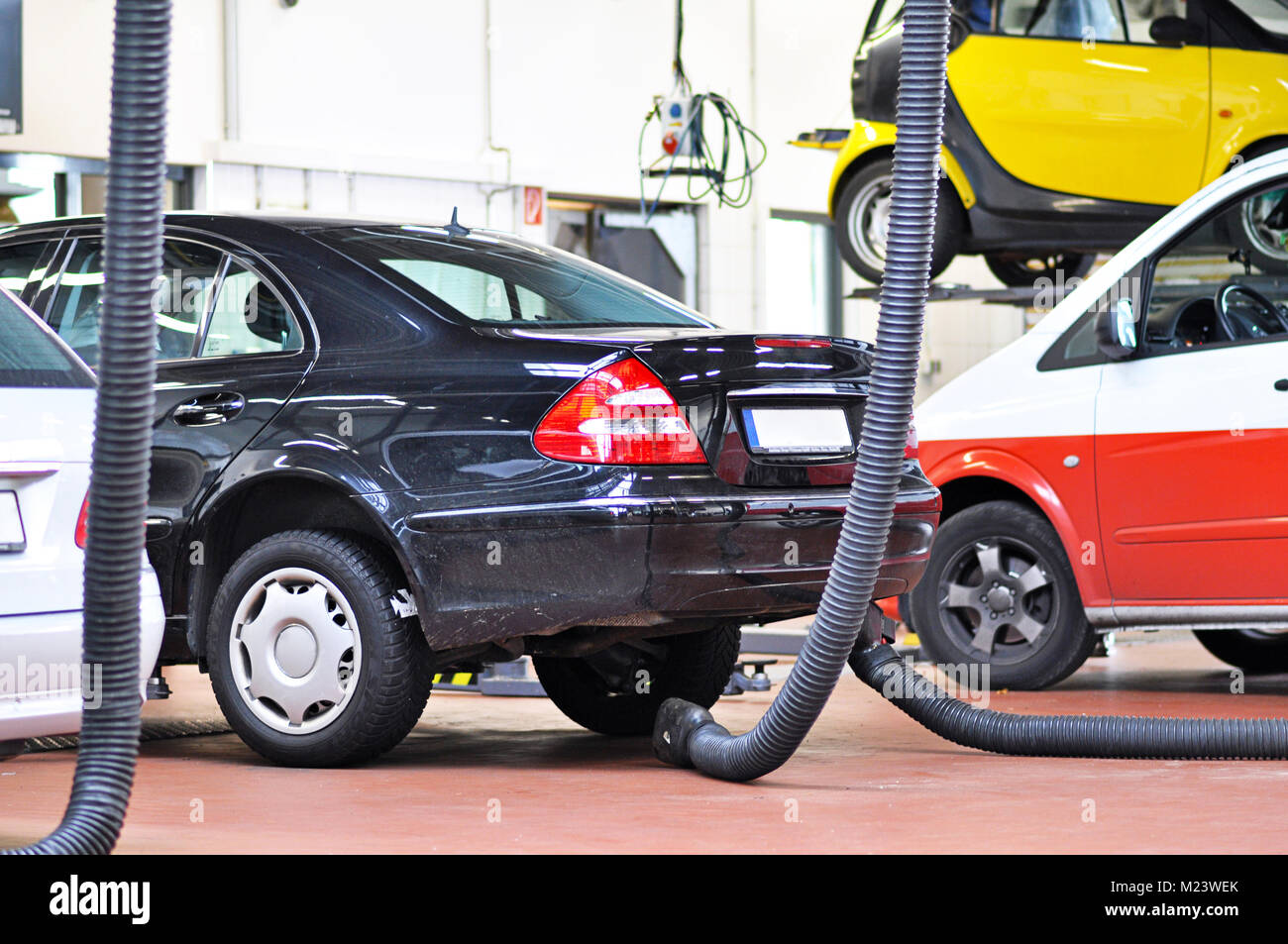 cars for emission test in a garage Stock Photo Alamy