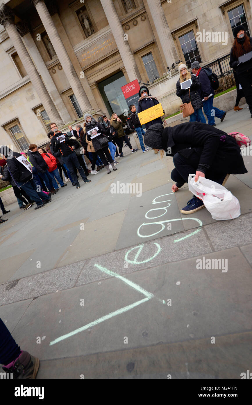 Animal rights activists gathered in Trafalgar Square in a ‘Circle of Silence’ spurred by a quote “Well-timed silence hath more eloquence than speech” – Martin Farquhar Tupper. The protesters taped their mouths shut Stock Photo