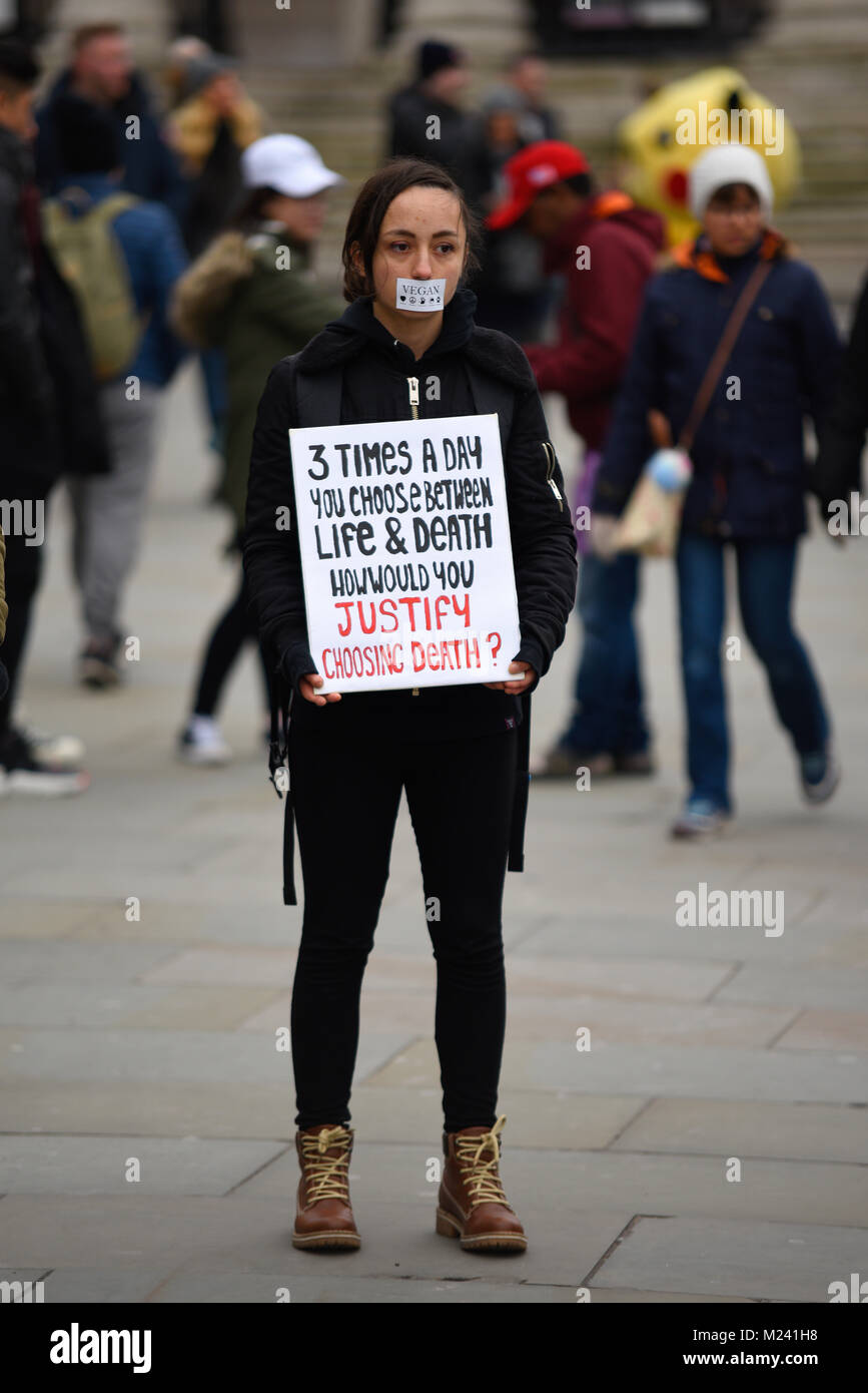 Animal rights activists gathered in Trafalgar Square in a ‘Circle of Silence’ spurred by a quote “Well-timed silence hath more eloquence than speech” – Martin Farquhar Tupper. The protesters taped their mouths shut Stock Photo