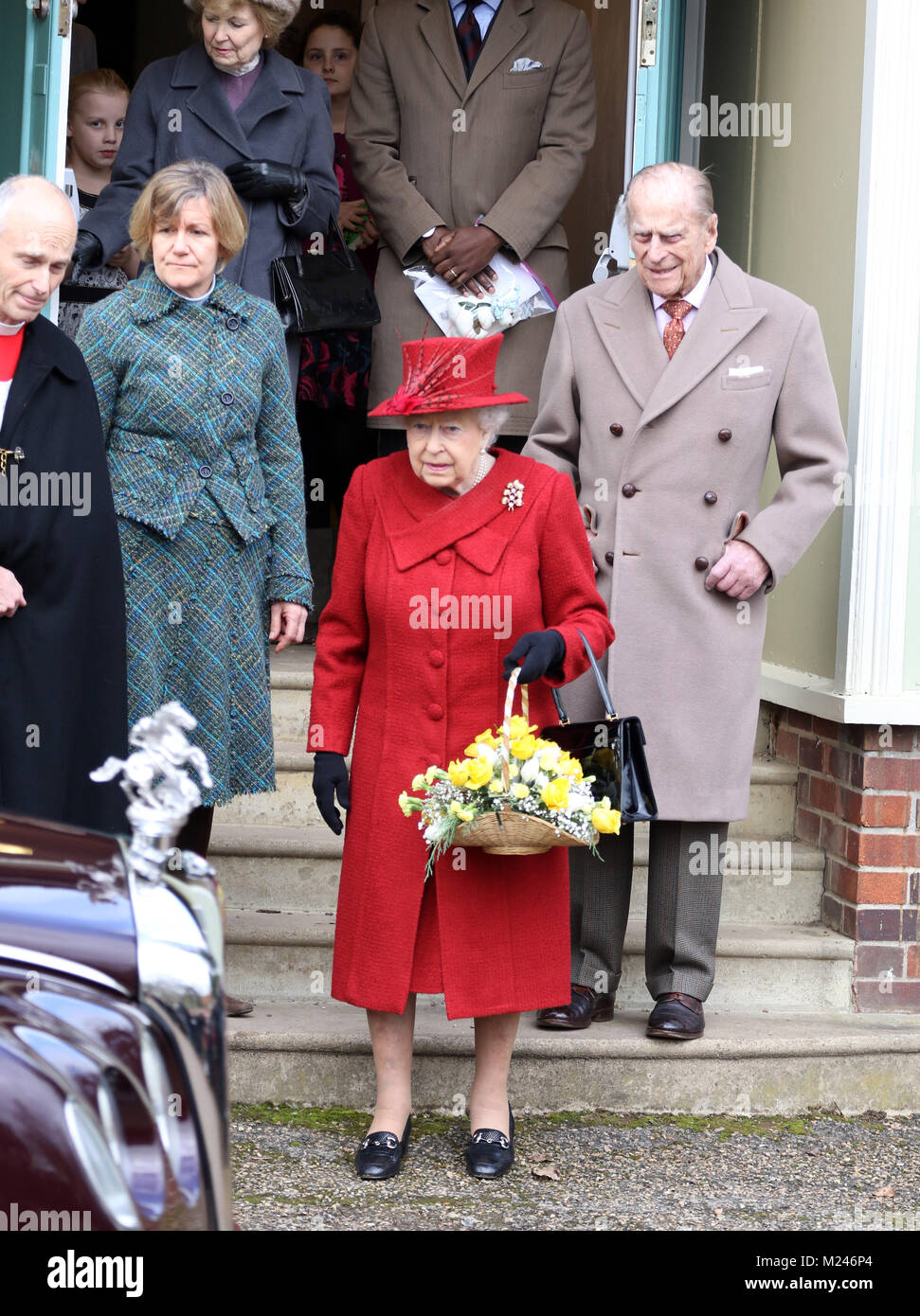 HM Queen Elizabeth II and Prince Philip, Duke of Edinburgh wait for their car after attending the Sunday morning service at St Peter and St Paul church at West Newton, Norfolk, on February 4, 2018. Credit: Paul Marriott/Alamy Live News Stock Photo