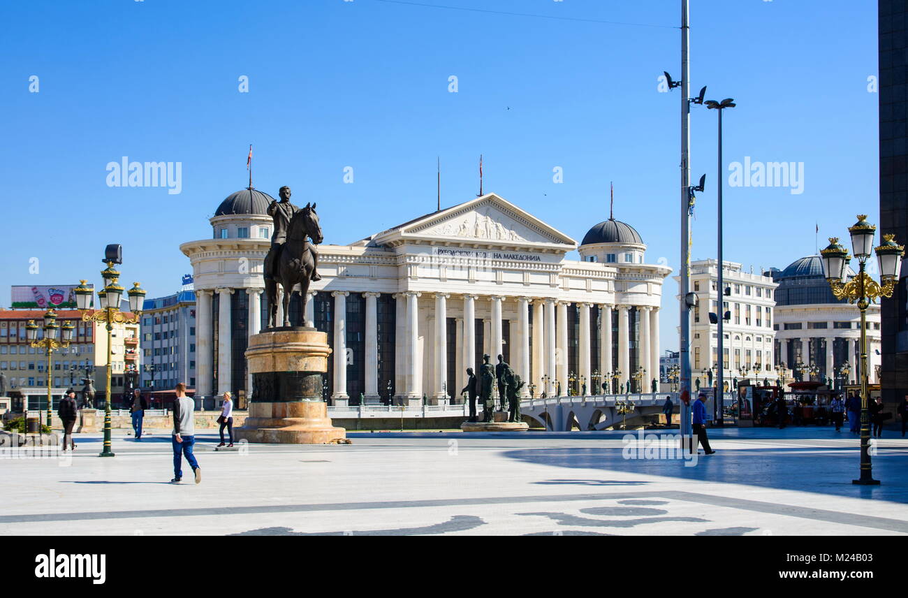 SKOPJE, MACEDONIA - OCTOBER 12, 2017: Macedonia square in Skopje city with Archeological museum and monuments on a sunny day Stock Photo