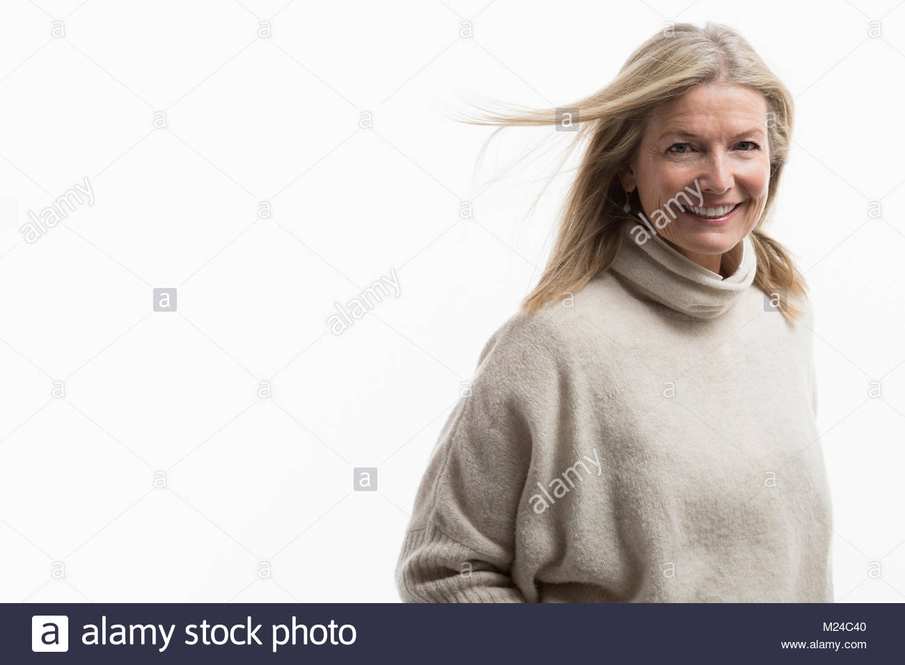 Confident mature woman standing hi-res stock photography and images - Alamy