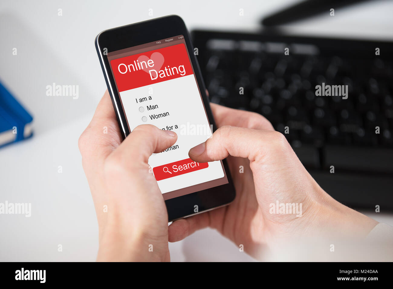 Close-up Of A Person Browsing Online Dating Website On Smart Phone Stock Photo
