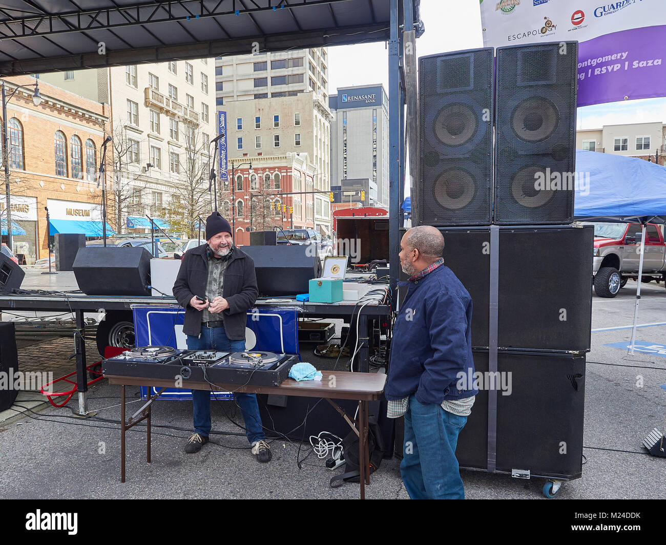 DJ or disc jocky at a local street celebration with old style turntables and vinyl records in Montgomery Alabama, United States. Stock Photo