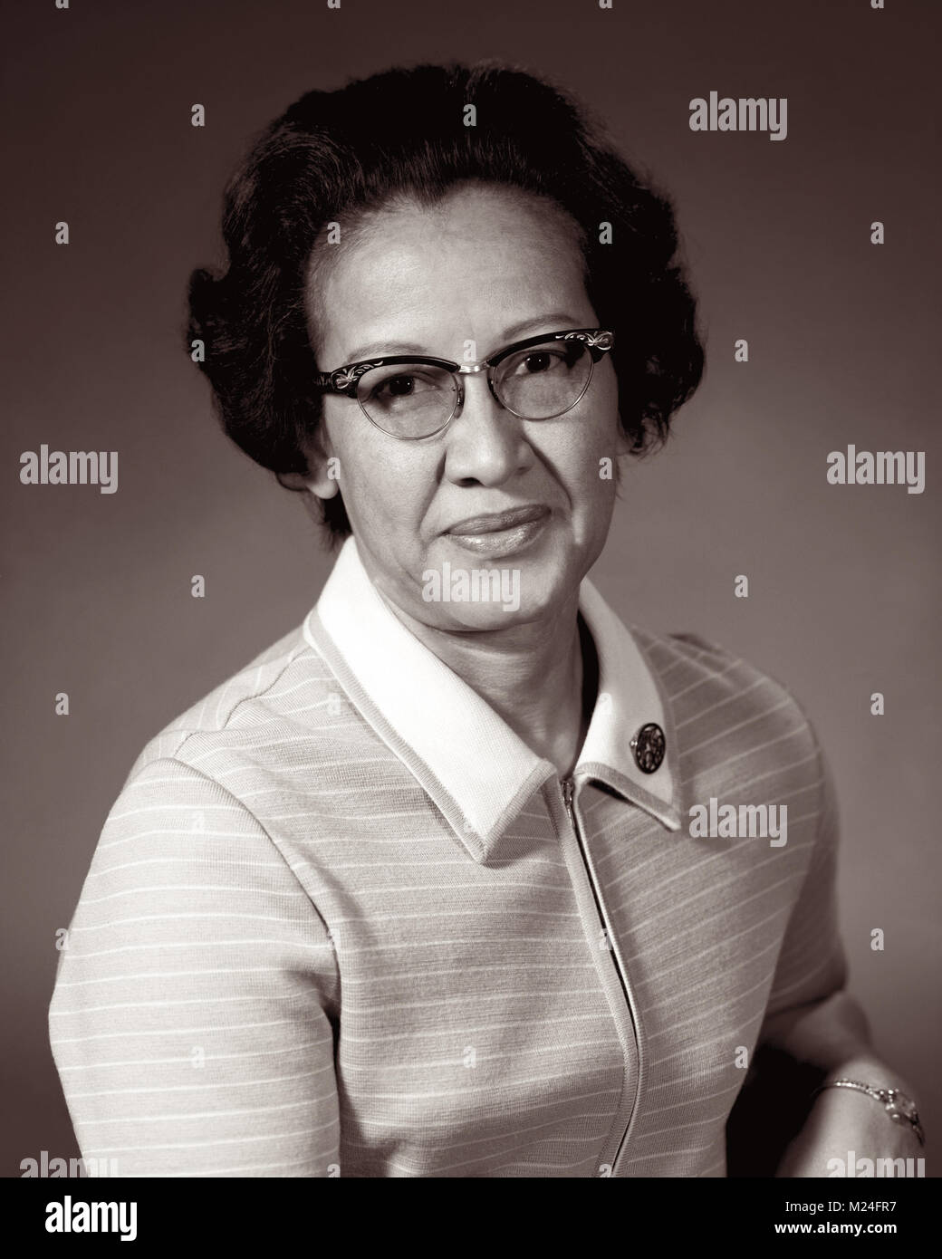 Katherine Johnson, one of NASA's 'human computers' featured in the movie Hidden Figures, is a mathematician and physicist who performed complex calculations that enabled humans to successfully achieve space flight. In 1953 Katherine began working at the National Advisory Committee for Aeronautics’ (NACA’s) Langley laboratory in the all-black West Area Computing section. In her career at NASA (formerly NACA), Johnson worked on the Apollo, Space Shuttle, and Mission to Mars programs. Photo: 1966. Stock Photo