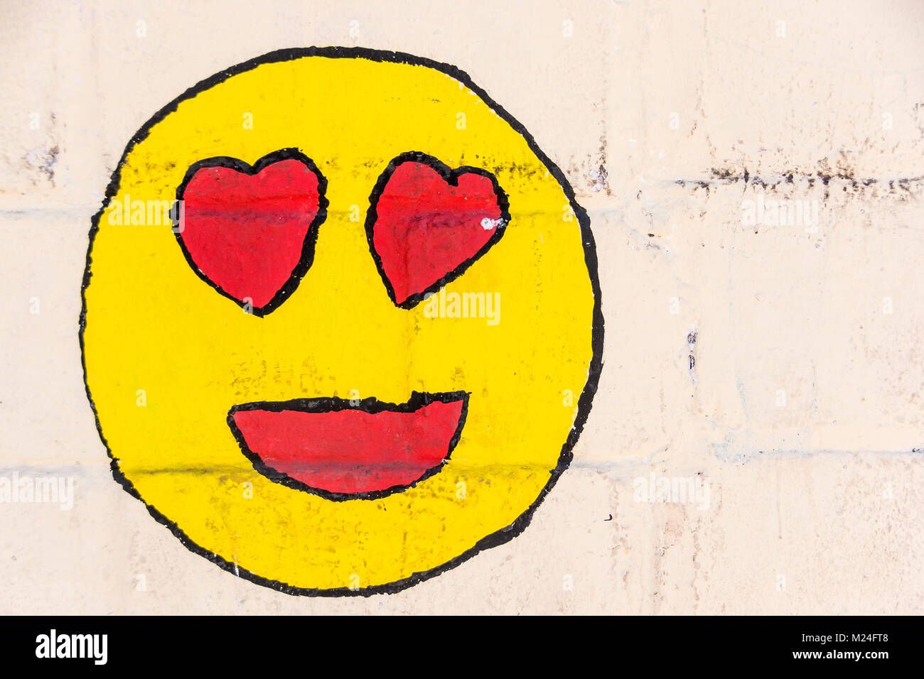 An emoji painted on a wall in Loreto, Baja, California, Mexico. Stock Photo