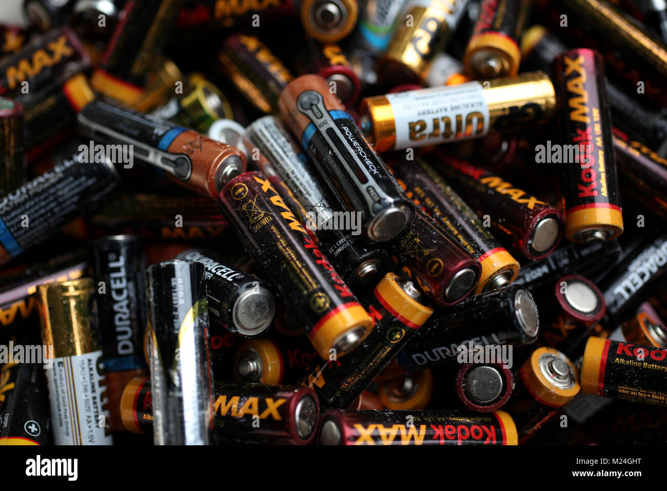 A collection of old AA batteries in a box in London, UK Stock Photo Alamy