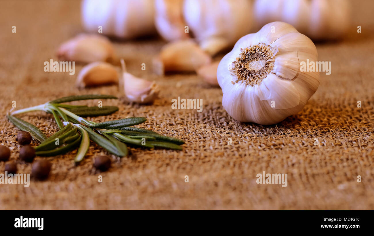 Garlic and cloves lying on a napkin. Healthy food and spices. Ad Stock ...