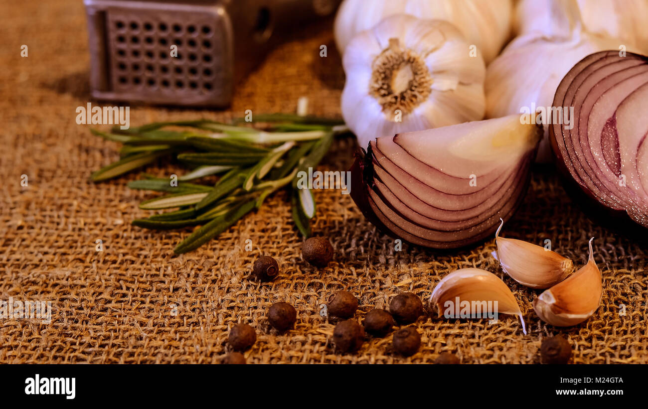 Garlic and cloves lying on a napkin. Healthy food and spices. Ad Stock ...