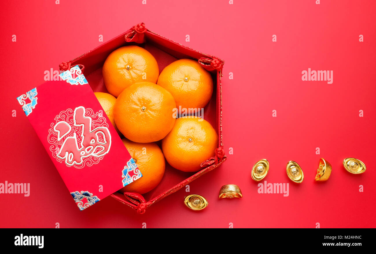 Group of orange tangerine in Chinese pattern tray and envelope packet